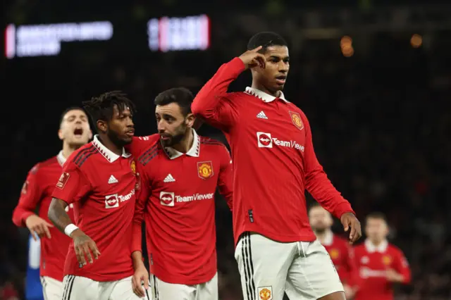 Manchester United's Marcus Rashford celebrates scoring their third goal against Everton in the FA Cup third round