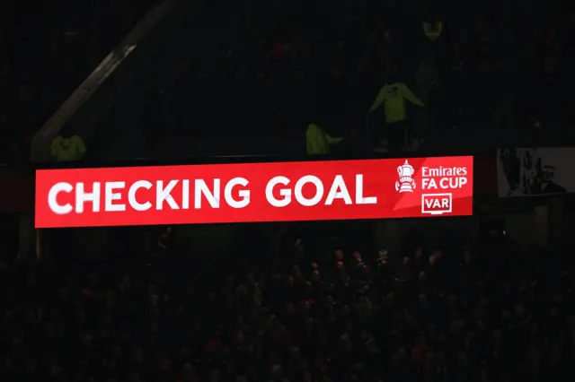 The scoreboard at Old Trafford showing that VAR was reviewing Dominic Calvert-Lewin of Everton goal which was eventually disallowed for offside during the Emirates FA Cup Third Round match between Manchester United and Everton