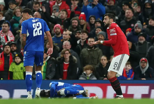 Bruno Fernandes protests after a foul is given for a tackle on Amadou Onana