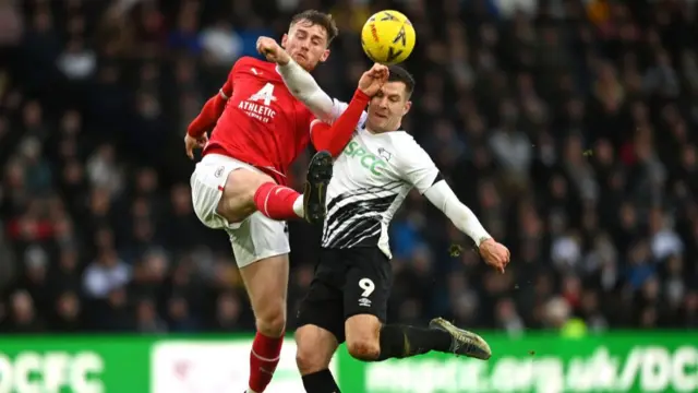 Robbie Cundy and James Collins during the game.