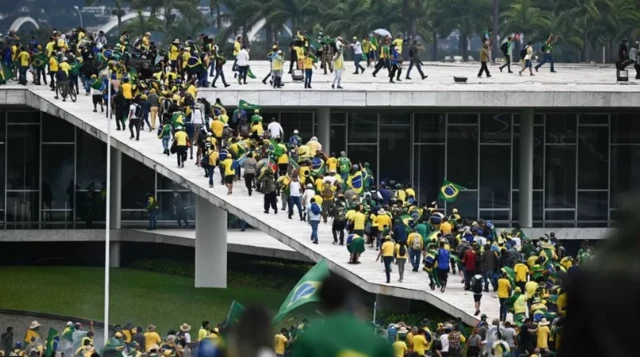 A crowd of people storming have stormed Congress, the Supreme Court and surrounded the presidential palace