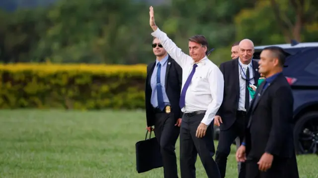 Brazil's President Jair Bolsonaro gestures to supporters