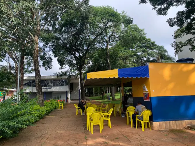 Locals having breakfast at a bloco cafe kiosk