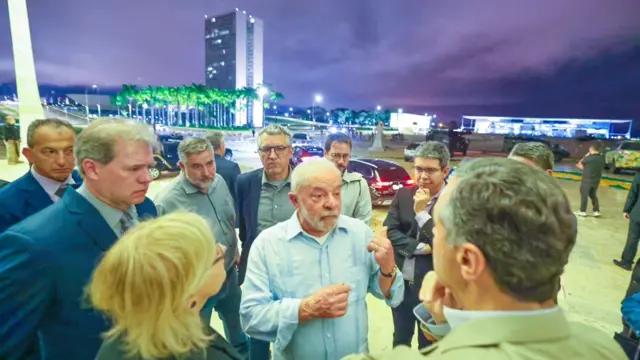 Brazil's President President Luiz Inacio Lula da Silva (known as Lula) speaking to people outside the Congress building after visiting the site of the attack