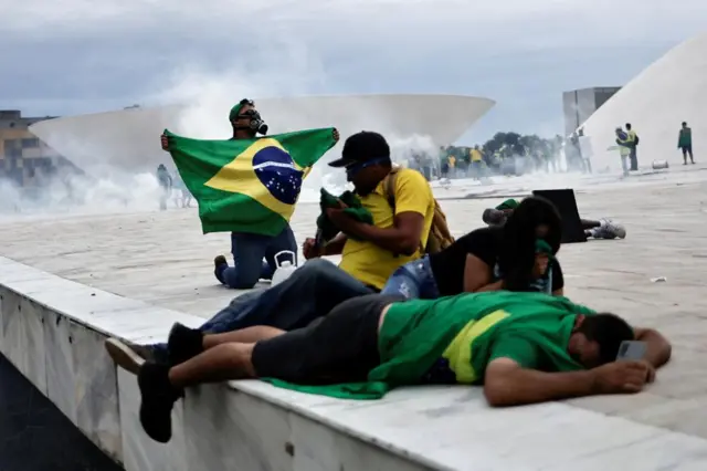 Supporters of Brazil's former President Jair Bolsonaro react during a demonstration against President Luiz Inacio Lula da Silva, outside Planalto Palace in Brasilia, Brazil