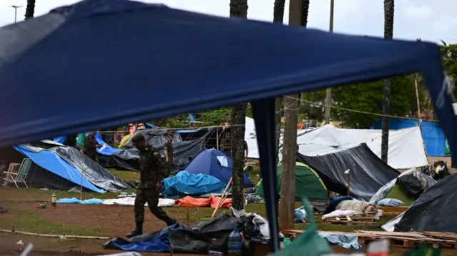 Army soldiers work to dismantle the tents of supporters of former President Jair Bolsonaro in a camp in front of the Army Headquarters, in Brasília