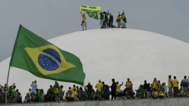 Supporters of Brazil's former president on top of the National Congress