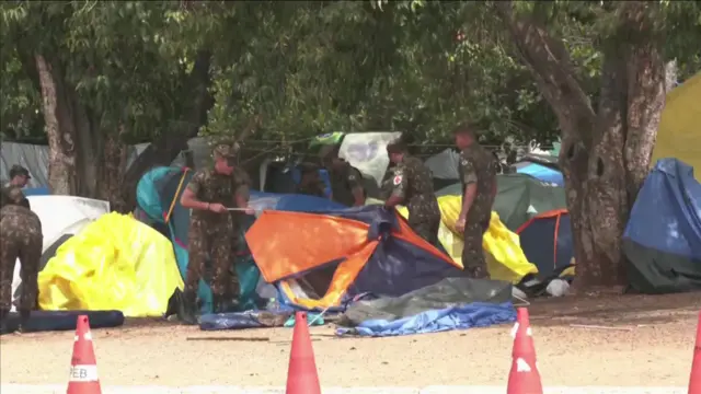 Brazilian military taking down tents