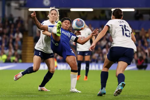 Fishel tries to flick the ball over the head of a pressuring defender.