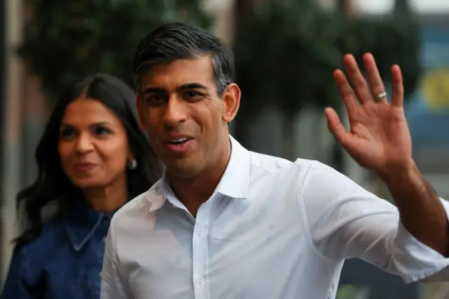 Rishi Sunak arriving in Manchester on Saturday with his wife, Akshata Murty