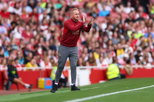 Eidevall claps his players from his technical area.