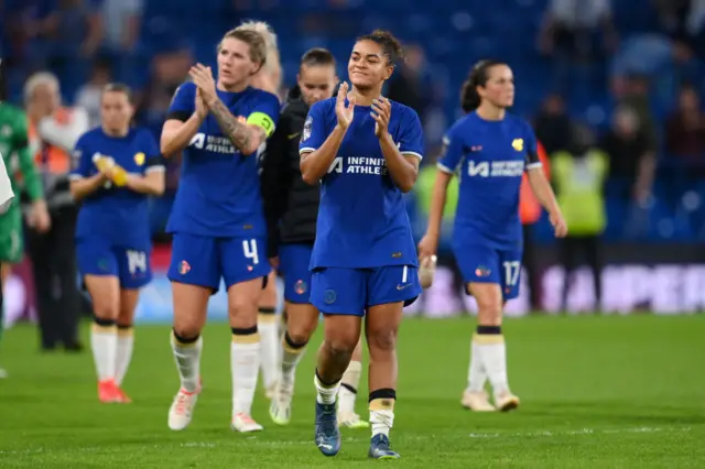 Chelsea players clap the fans as they do a lap of appreciation at full time.