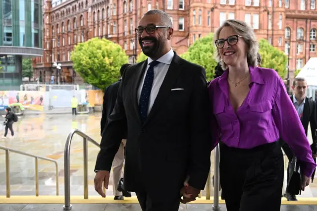 James Cleverly and his wife arrive