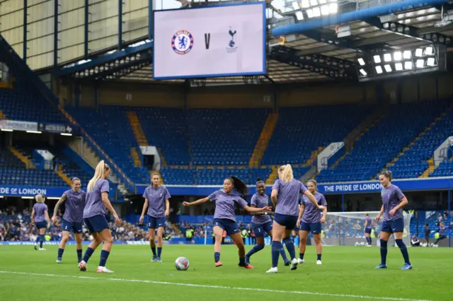 Tottenham players warm up at Stamford Bridge.