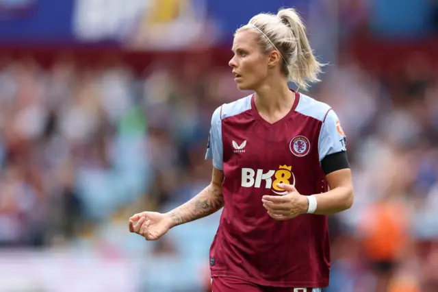 Daly looks towards the sideline as she receives instructions.