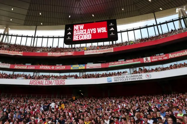 The scoreboard displays a new attendance record set by Arsenal.