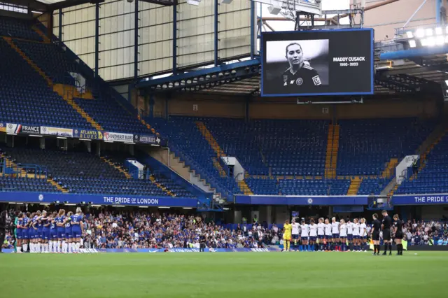 Players observe a moment's silence for the late Maddy Cusack.