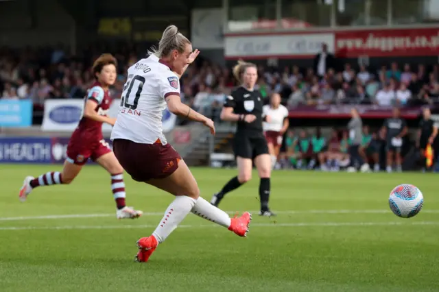 Roord curls in her first WSL goal for Man City.