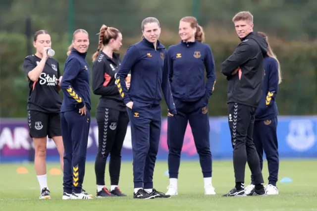 Everton players survey the pitch before kick off.