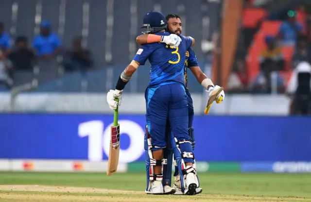 Sadeera Samarawickrama of Sri Lanka celebrates with teammate Dasun Shanaka after their century during the ICC Men's Cricket World Cup India 2023 between Pakistan and Sri Lanka