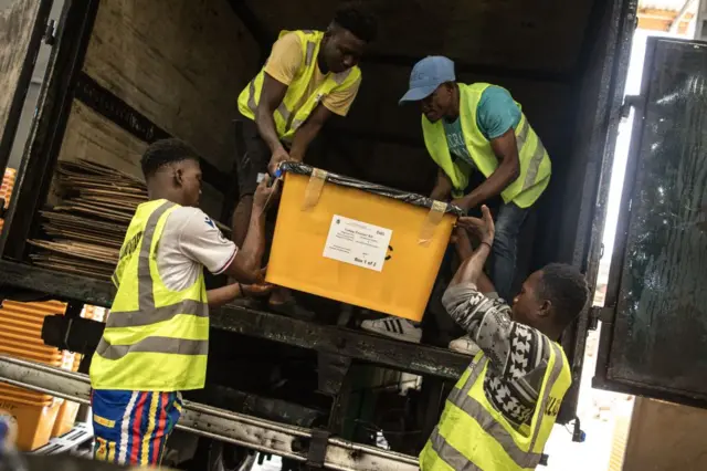 National Elections Commission (NEC) agents load trucks with election material in Monrovia on October 09, 2023. Outgoing president George Weah, a legend of African soccer, is aiming for re-election in the first round of Liberia's presidential election on Tuesday, where he is the favorite of nineteen candidates. More than 2.4 million voters are expected to cast their ballots in this small English-speaking West African country, which dreams of development and peace after years marked by wars and epidemics.