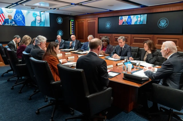 White House leaders sat around a table during a conference call with Israeli leaders