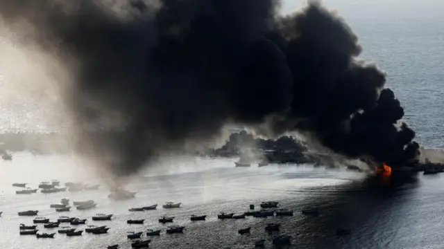 Smoke rises after Israeli strikes on the seaport of Gaza City, in Gaza, October 10, 2023.