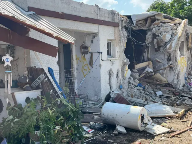 A ruined building in Kfar Aza kibbutz