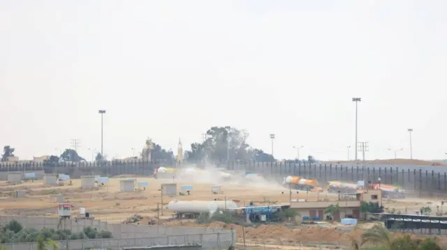 Trucks carrying aid are seen near the Rafah border in Gaza after entering from Egypt