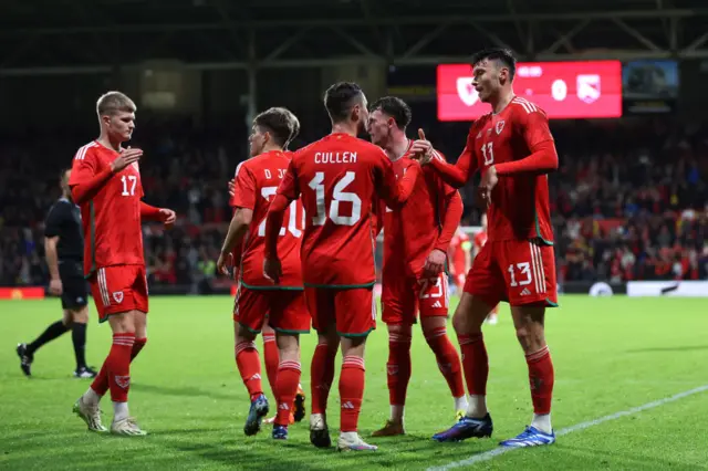 Wales players celebrate scoring against Gibraltar