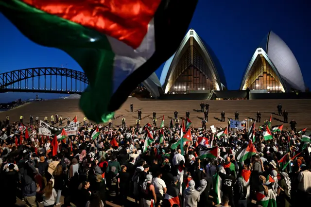 Thousands with flags outside Sydney Opera House