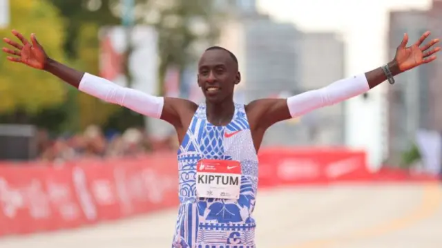 Kelvin Kiptum of Kenya celebrates after winning the 2023 Chicago Marathon professional men's division and setting a world record marathon time of 2:00.35 at Grant Park on October 08, 2023 in Chicago, Illinois