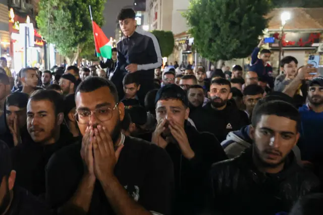 Palestinians marching in Ramallah in the occupied West Bank