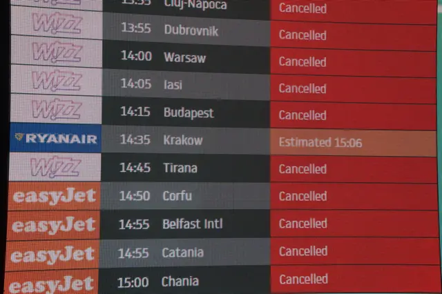 An information board at Luton Airport, which has been closed with flights suspended until at least 13:00 BST on Wednesday