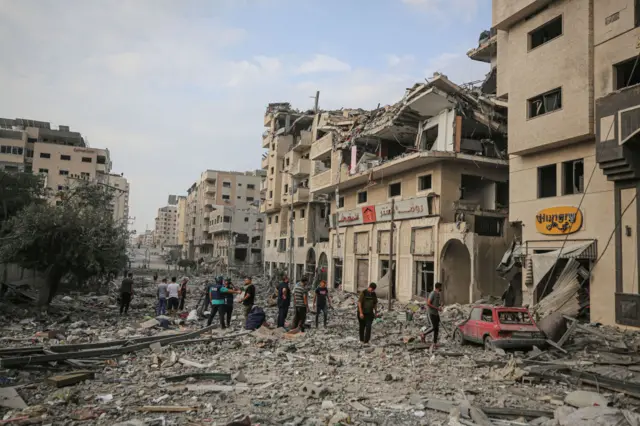 The aftermath of an airstrike in a Gazan neighbourhood