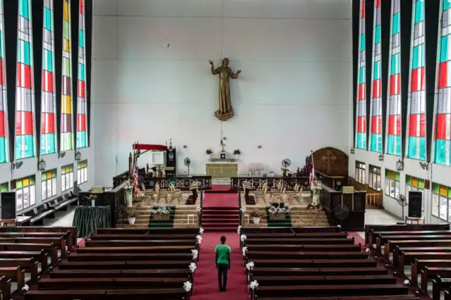 A caretaker insideTrinity Cathedral in Monrovia, Liberia.