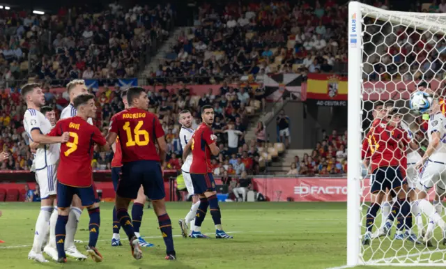 Scotland's Scott McTominay scores a free kick before his goal is ruled out after a VAR check during a UEFA Euro 2024 Qualifier at the Estadio De La Cartuja