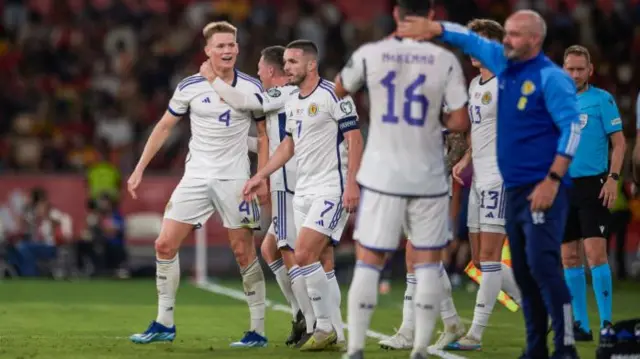 Scotland players celebrate after netting from a fabulous free-kick