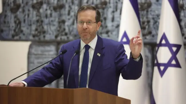 Israeli President Isaac Herzog hold a briefing for foreign journalists on Israel's war on Hamas at the presidential residence in Jerusalem