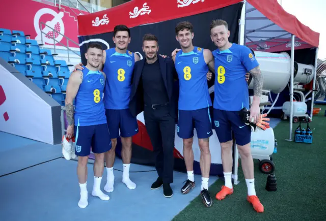 David Beckham (centre) with England players Kieran Trippier, Harry Maguire, John Stones and Jordan Pickford