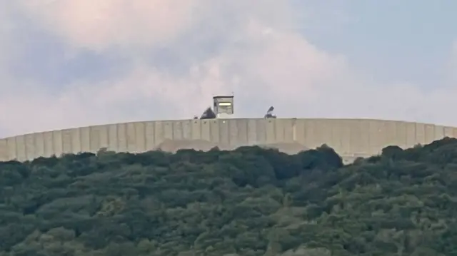 Concrete wall on border