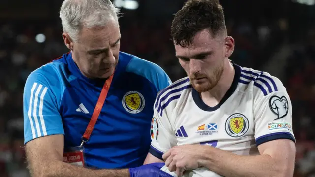 Scotland captain Andy Robertson goes off injured