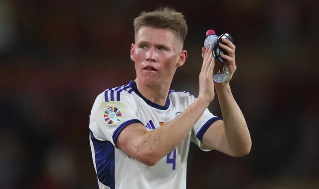 Scott McTominay applauds Scotland fans in Seville