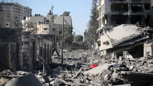 Palestinian citizens inspect damage to their homes caused by Israeli airstrikes on October 13, 2023 in Gaza City,