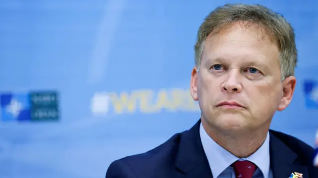 UK Defence Minister Grant Shapps looks on during the signing ceremony during a NATO Defence Ministers' meeting at the Alliance's headquarters in Brussels on October 11, 2023