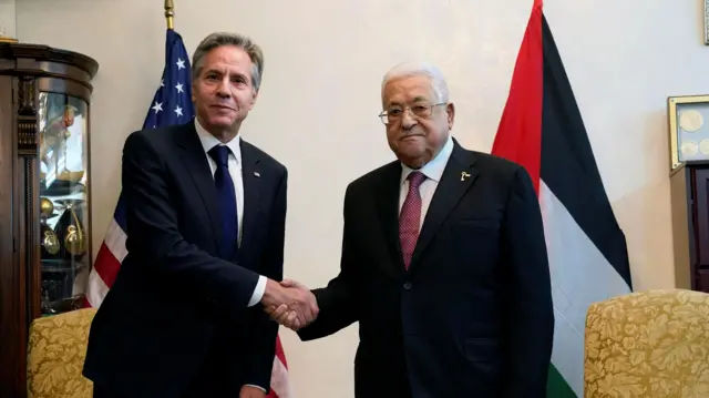 US Secretary of State Antony Blinken shake hands with Palestinian President Mahmoud Abbas, in Amman, Jordan, Friday Oct. 13, 2023.