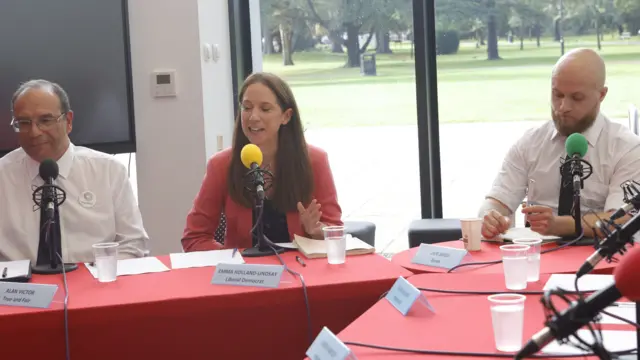 Three candidates in a political debate