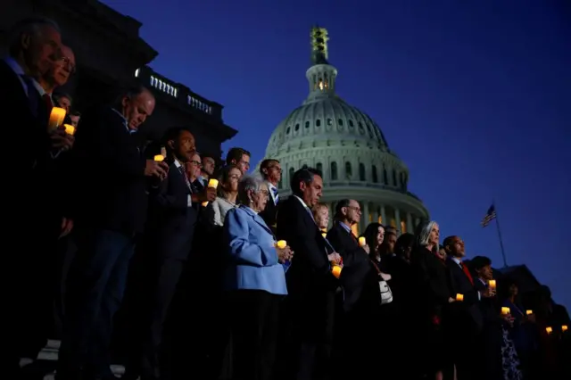 Members of the House of Representatives hold a candlelight vigil for Israel outside the US Capitol building in Washington