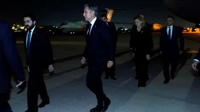 U.S. Secretary of State Antony Blinken walks to his motorcade vehicle after arriving in Amman, Jordan