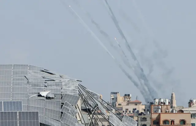 Rockets are fired from Gaza towards Israel - streaks of smoke seen in the sky